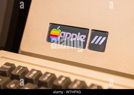 Istanbul, Turkey, March 2019: Closeup old rainbow Apple logo on old Macintosh computer. Rahmi Koc museum. Stock Photo