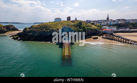 Aerial drone view of old and new lifeboat houses in the picturesque Welsh seaside town of Tenby Stock Photo