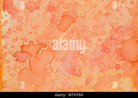 orange color ink watercolor painted on paper  background texture Stock Photo
