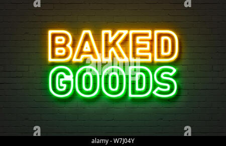 Baked goods neon sign on brick wall background Stock Photo
