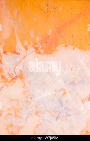 Background of pink and orange yatlian marble with beautiful stains. The natural structure of natural stone in the interior, building and architecture. Stock Photo