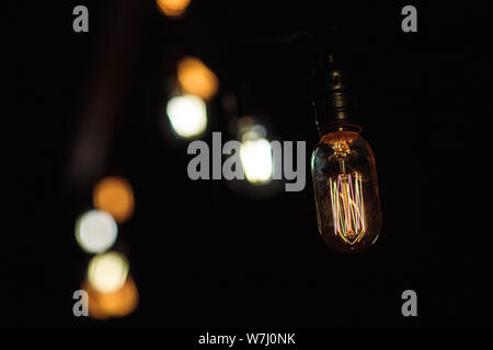 Close up hanging light bulbs - retro style. Stock Photo