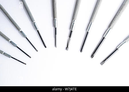 Mini screwdriver set closeup macro isolated on white background Stock Photo
