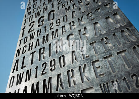 A metal slab acting as a gateway sign welcoming people to the town of Altrincham, Cheshire, UK. Stock Photo