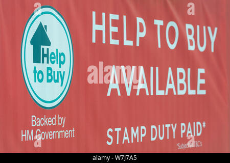 Signage promoting the UK government's Help To Buy scheme located in the vicinity of new build housing developments. Stock Photo