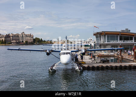 Twin Otter Seaplane with a row of turbo Beaver planes in Victoria Harbour British Columbia Canada Stock Photo