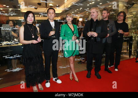 South Korean singer-songwriter Lee Chae-rin, third left, better known by her stage name CL, of South Korean girl group 2NE1 attends the opening ceremo Stock Photo