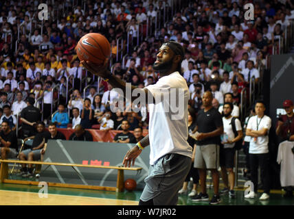 NBA star LeBron James of Cleveland Cavaliers shows his basketball skills during a fan meeting event in Hong Kong, China, 5 September 2017. Stock Photo