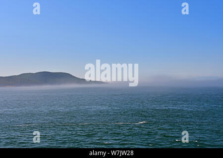 Morning fog on the Salish Sea near Anacortes, Washington, USA Stock Photo