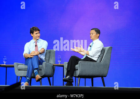 Jack Ma or Ma Yun, right, chairman of Chinese e-commerce giant Alibaba Group, and Canadian Prime Minister Justin Trudeau participate in a fireside cha Stock Photo