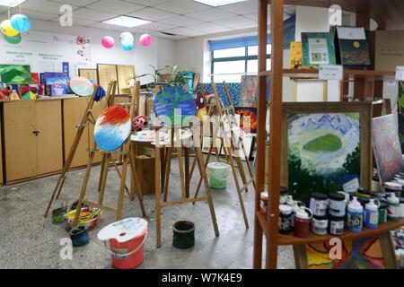 Colorful paintings created by children with mental and intellectual disabilities as a part of a charity project titled 'Enlighten Life with Art' initi Stock Photo