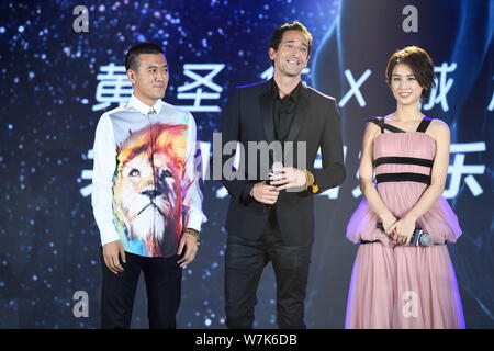 (From left) Yang Zi, president of China Juli Entertainment Media Co., Ltd. and the husband of Huang Shengyi, American actor and producer Adrien Brody, Stock Photo