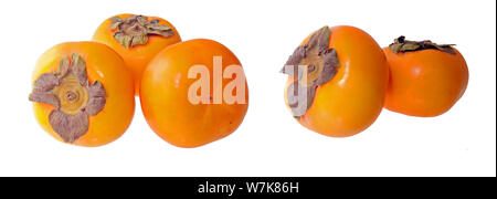 two groups of ripe persimmons isolate on white background Stock Photo