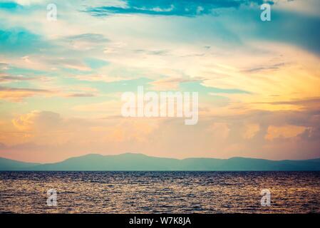 Colorful sunset over the calm sea. Stock Photo