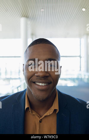 Businessman smiling to camera at work Stock Photo