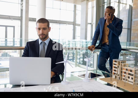 Two businessmen working in a modern office Stock Photo