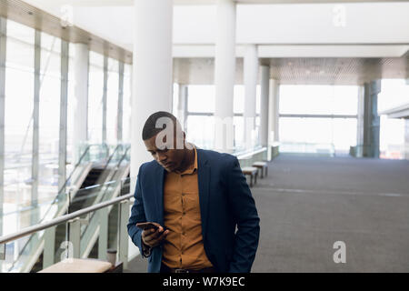 Businessman using smartphone at work Stock Photo