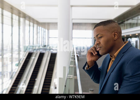 Businessman using smartphone at work Stock Photo