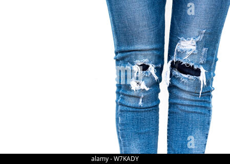 close up woman legs wear jeans on white background Stock Photo