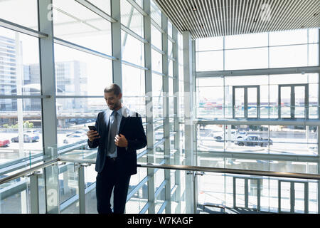 Businessman using smartphone at work Stock Photo