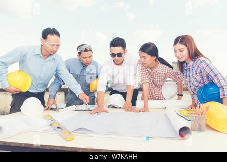 Asian team engineer working in construction site. construction concept Stock Photo