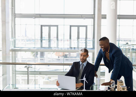 Two businessmen working together in a modern office Stock Photo