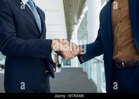 Two businessmen shaking hands Stock Photo