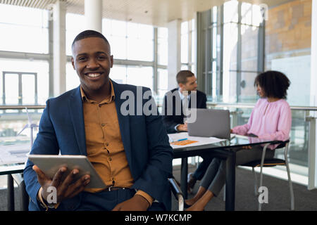 Diverse young business people working in modern office Stock Photo