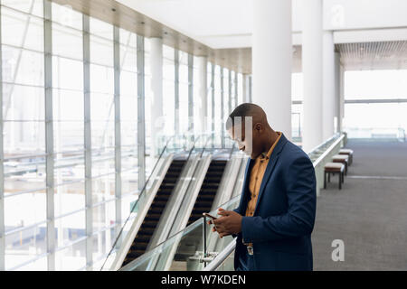 Businessman using smartphone at work Stock Photo