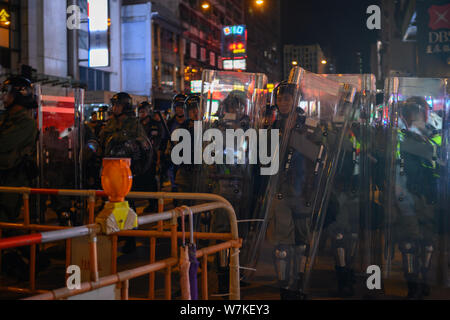 Hong Kong - Aug 3, 2019: Hong Kong August 3 protest which is rejected by police force. Police swearing Street in mong kok. Stock Photo