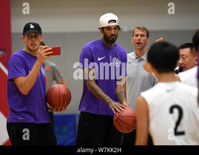 American basketball players Willie Cauley-Stein, right, and Kyle Wiltjer visit Lam Tai Fai College during the 2017 Yao Foundation Charity Tour in Hong Stock Photo