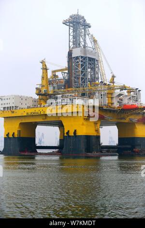 The ultra-deep-water semi-submersible drilling rig 'Blue Whale II', which can mine both combustible ice and oil, is pictured at a harbour in Yantai ci Stock Photo