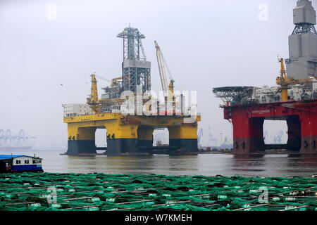 The ultra-deep-water semi-submersible drilling rig 'Blue Whale II', which can mine both combustible ice and oil, is pictured at a harbour in Yantai ci Stock Photo