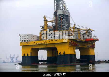 The ultra-deep-water semi-submersible drilling rig 'Blue Whale II', which can mine both combustible ice and oil, is pictured at a harbour in Yantai ci Stock Photo