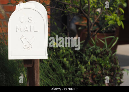Old mail box. Vintage metal white post box . Old Mailbox made of metal with POST caption Stock Photo