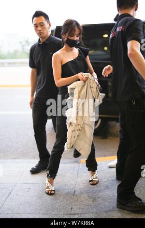 Taiwanese singer Jolin Tsai dressed in a Uniqlo Doraemon X Takashi Murakami  UT is pictured at the Beijing Capital International Airport in Beijing, Ch  Stock Photo - Alamy