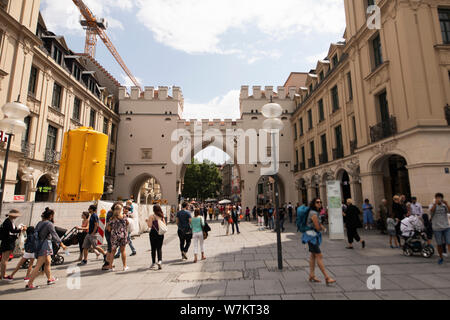 The Karlstor, one of the old gates of the city of Munich, Germany, at the busy tourist area of Karlsplatz at Neuhauser Strasse. Stock Photo