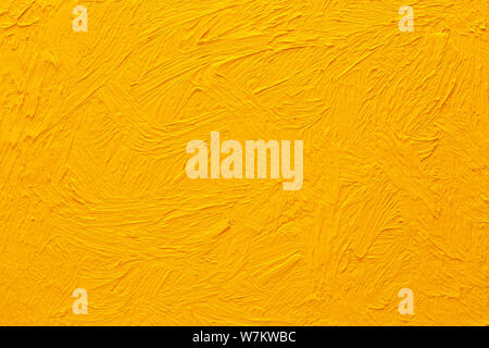 Abstract painted background. Background was painted with yellow orange oil color on canvas by hand. Stock Photo