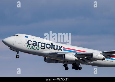 Novosibirsk, Russia - April 1, 2019: Boeing 747-4R7F(SCD) LX-TCV Cargolux Italia Airlines in the sky after take off from the international airport Tol Stock Photo