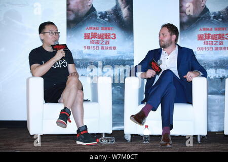 Chinese director Lu Chuan, left, and visual effects supervisor Ander Langlands attend a promotional event for the movie 'War for the Planet of the Ape Stock Photo