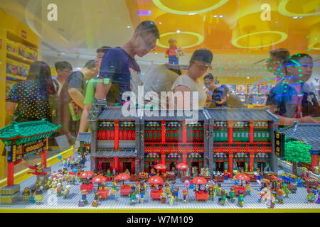 Visitors look at the LEGO sculpture of Guwenhua Jie, Tianjin's Ancient Culture Street, made of 30,000 LEGO bricks, at Tianjin's first LEGO Authorized Stock Photo