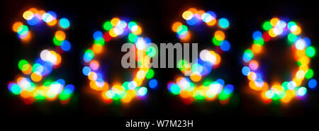 Happy 2020. Happy new year abstract concept. Numbers made with decorative garland bokeh lights Stock Photo
