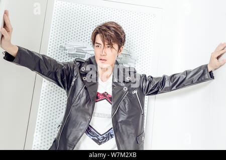 Taiwanese singer Kenji Wu poses for portrait photos during an exclusive interview by Imaginechina in Beijing, China, 22 August 2017. Stock Photo