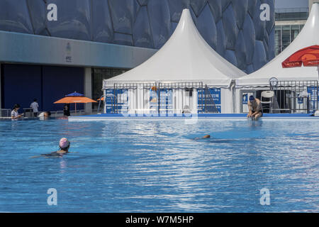 Local Residents Go Swimming In The 25 Meter Long And 15 Meter Wide Detachable And Infinity Edge Pool Near The National Aquatics Center Also Known As Stock Photo Alamy