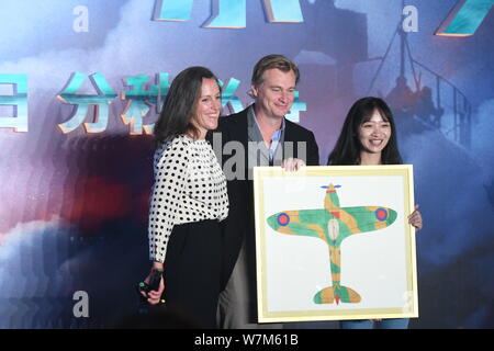 British film director Christopher Nolan, center, and British film producer Emma Thomas, left, attend a press conference for their new movie 'Dunkirk' Stock Photo