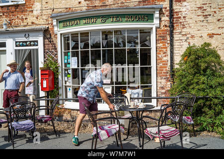 Heydon Tea Shop clearing tables and working hard Stock Photo