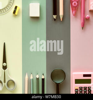 Back to school, concept flat lay background in pastel colors. Stationary items on paper background, square composition, toned image with text space. Stock Photo