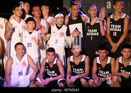 **TAIWAN OUT**NBA star Jeremy Lin of Brooklyn Nets, center right, and Taiwanese singer Jam Hsiao, center left, pose during a public welfare event in T Stock Photo