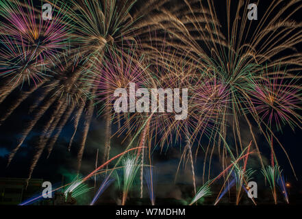 Colorful fireworks close up, fireworks explosion in dark sky. Ventspils city festival. Latvia. Stock Photo