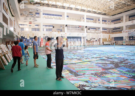 A huge collage showing a rendition of Vincent Van Gogh's masterpiece The Starry Night created by nearly 10,000 children is on display at an art festiv Stock Photo